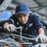 portrait-asian-mechanic-checking-safety-600nw-2180535839