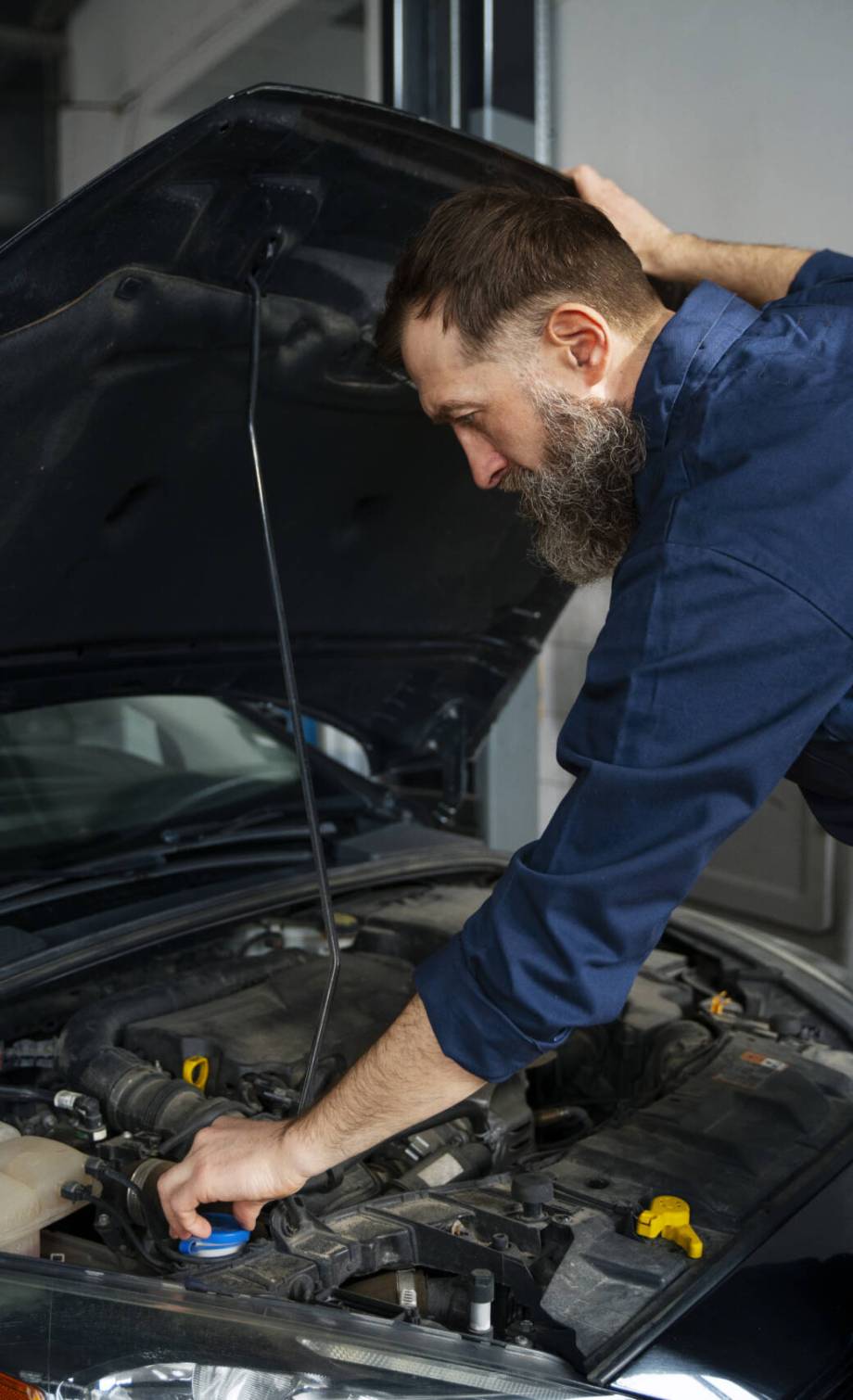 male-mechanic-working-auto-repair-shop-car