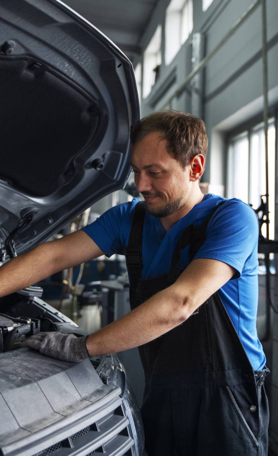 male-mechanic-working-car-auto-repair-shop